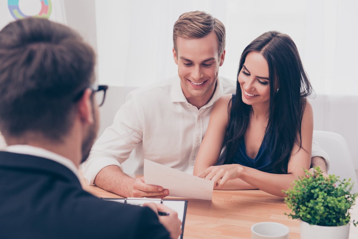 A property manager discussing a document with tenants