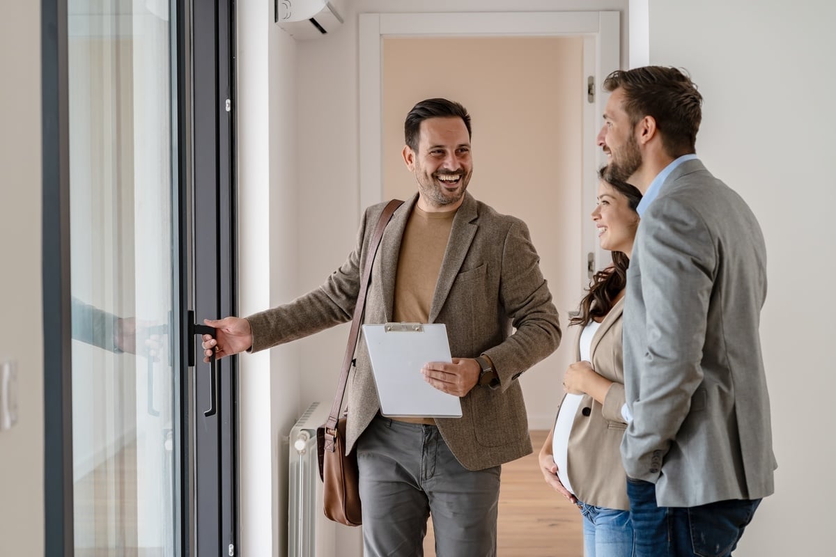 A property manager showing potential tenants an apartment