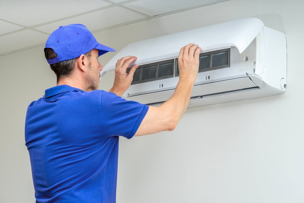 A technician working on an HVAC system, how to keep renters concept