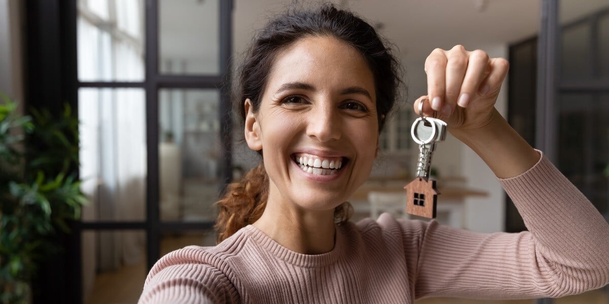 A woman holding house keys