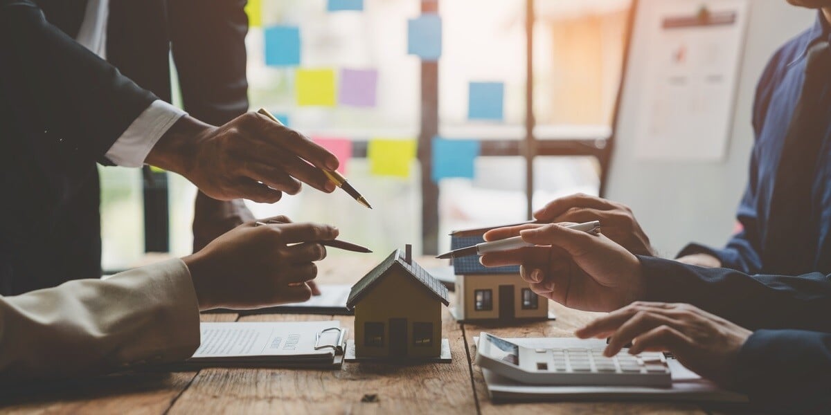 A property management team discussing a home