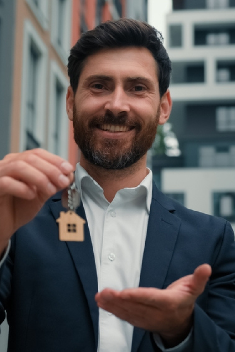 property manager offering keys to new tenants